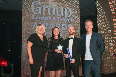 Amy Sowden (left) of the Brend Collection presents the GLT award to Faye Kelly and Scott Lawrence from Hever Castle, alongside host Paul Zerdin.